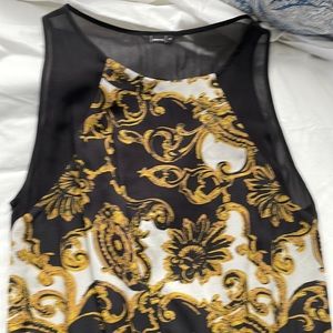 Pretty sheer Dolce Vita dress with circle cut out in back